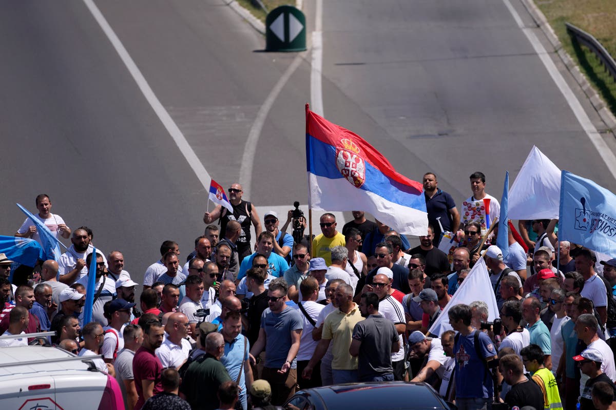 Car factory workers block key motorway in Serbia capital