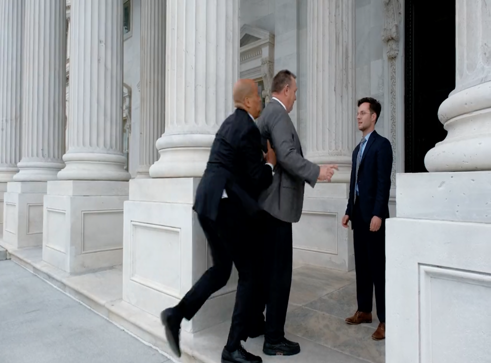 <p>The New Jersey senator scoops up his Montana counterpart on the steps of the Capitol in a recent political ad</p>
