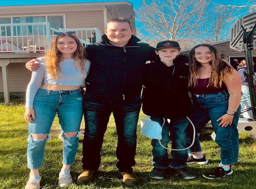 <p>Eric Coulam, senter, poses with his friends at the celebration of life held at his father’s home in Fort St John, BC on 21 Kan</s>