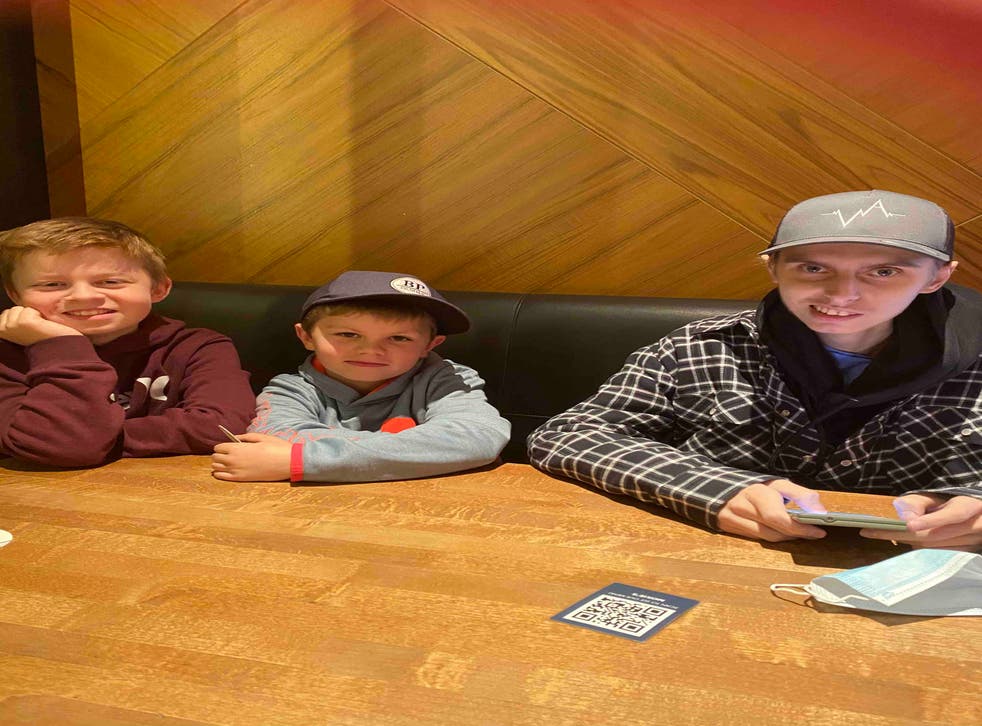<p>Eric Coulam and his two younger brothers while on a five-day family vacation they took in November 2020, one of the first excursions he was able to do after a months-long stay in an Alberta hospital</p>
