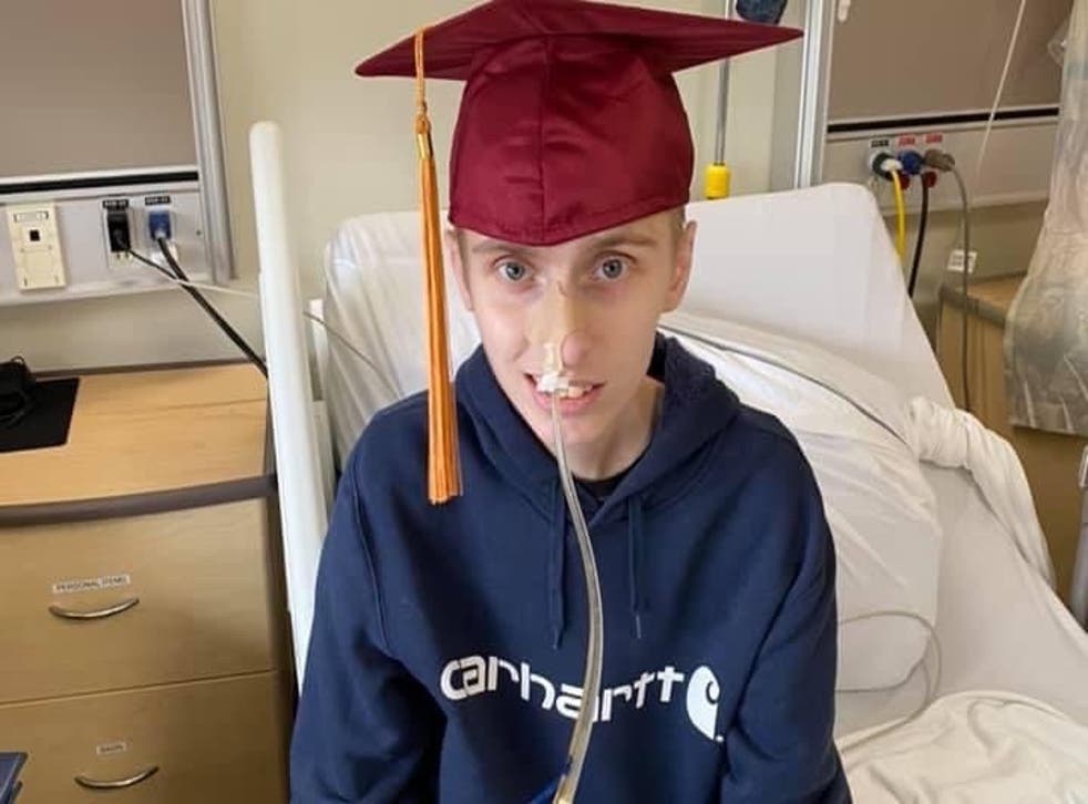 <p>Eric poses in hospital with a graduation cap. He graduated high school early and later perused his goal of becoming a heavy duty mechanic by starting his level 1 apprenticeship in college</p>