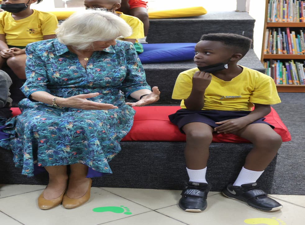 The Duchess of Cornwall speaks to a student using sign language (Chris Jackson/PA)