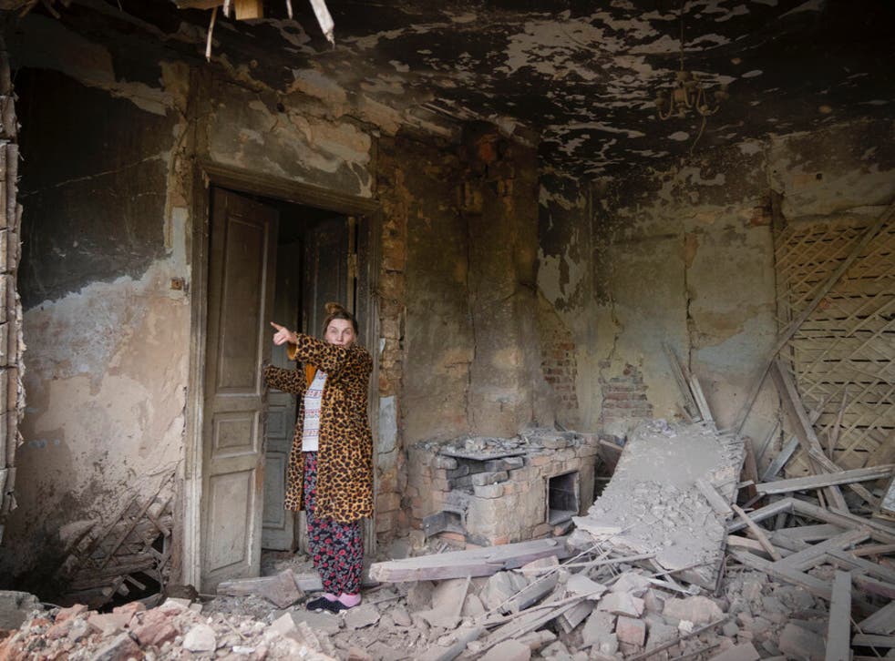 <p>Tetyana shows the destruction caused to her home</bl>