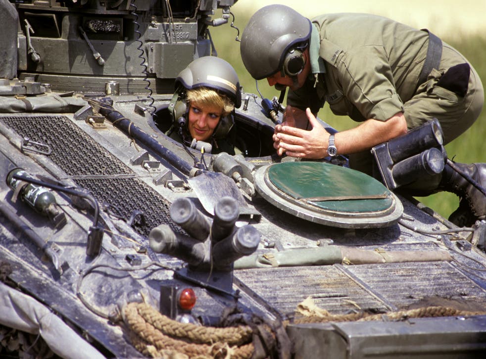 The then princess of Wales in the driving seat of the ‘Striker’ tank, getting instructions from Sgt Chris O’Byrne on Salisbury Plain in 1988 (Ron Bell/PA)