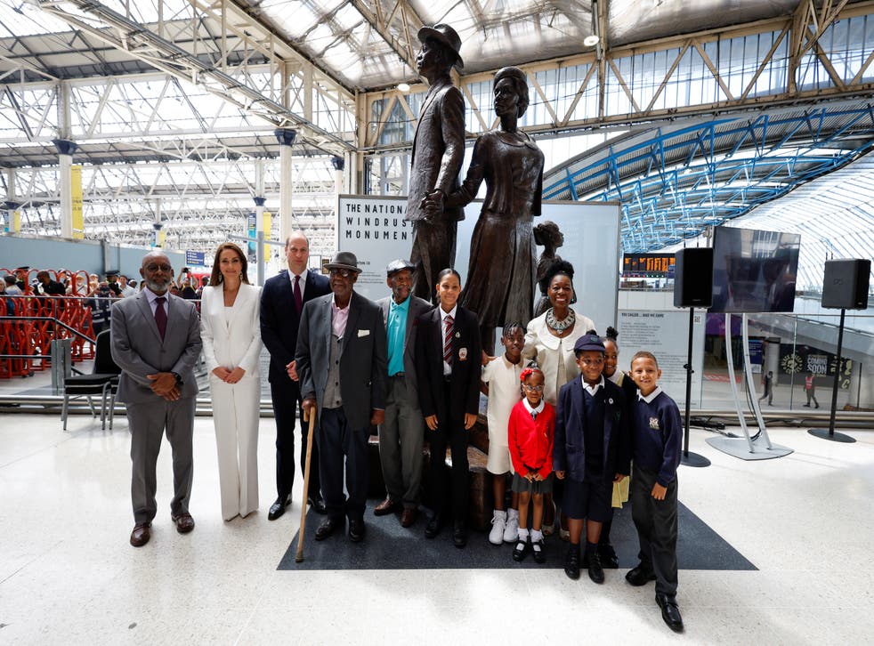 The Duke and Duchess of Cambridge, accompanied by Baroness Floella Benjamin, Windrush passengers Alford Gardner and John Richards and children at the unveiling of the National Windrush Monument at Waterloo Station (John Sibley/PA)