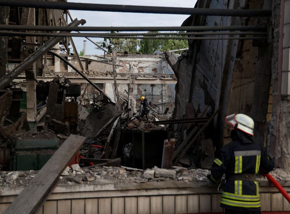 <p>Rescuers work at a site of a facility of the Darnytsia Car Repair Plant</磷>