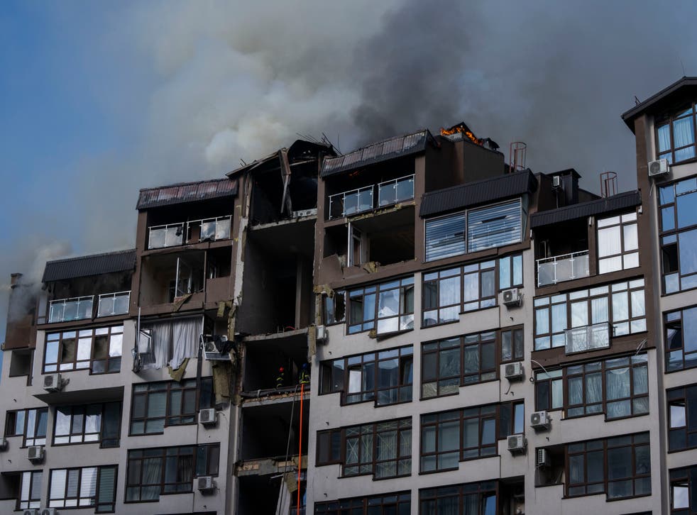 Smoke billows into the air from residential buildings following explosions in Kyiv on Sunday (Nariman El-Mofty/AP)
