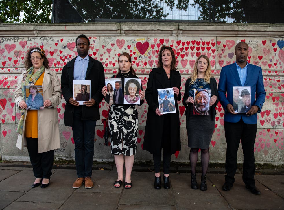 <p>Representatives from Covid-19 Bereaved Families for Justice at the Covid Memorial Wall</p>