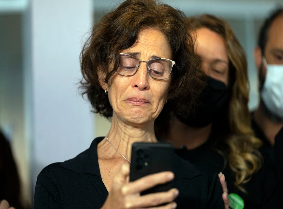<p>Alessandra Sampaio speaks to the media during the funeral of her husband </s>