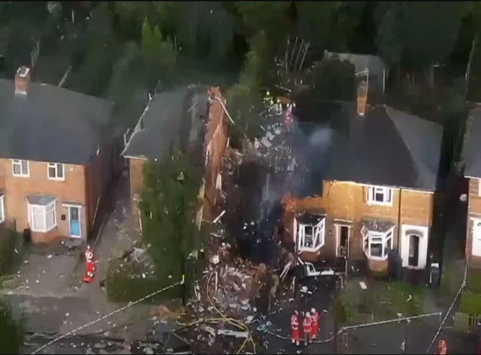 A group of rescuers broke damaged water pipes, amid the rubble, to try to douse their own clothes, to protect from the flames (West Midlands Fire Service/PA)
