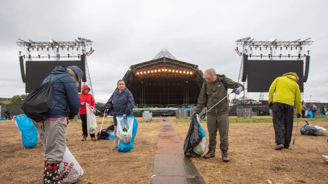 The cleaning up begins after the Glastonbury Festival at Worthy Farm 