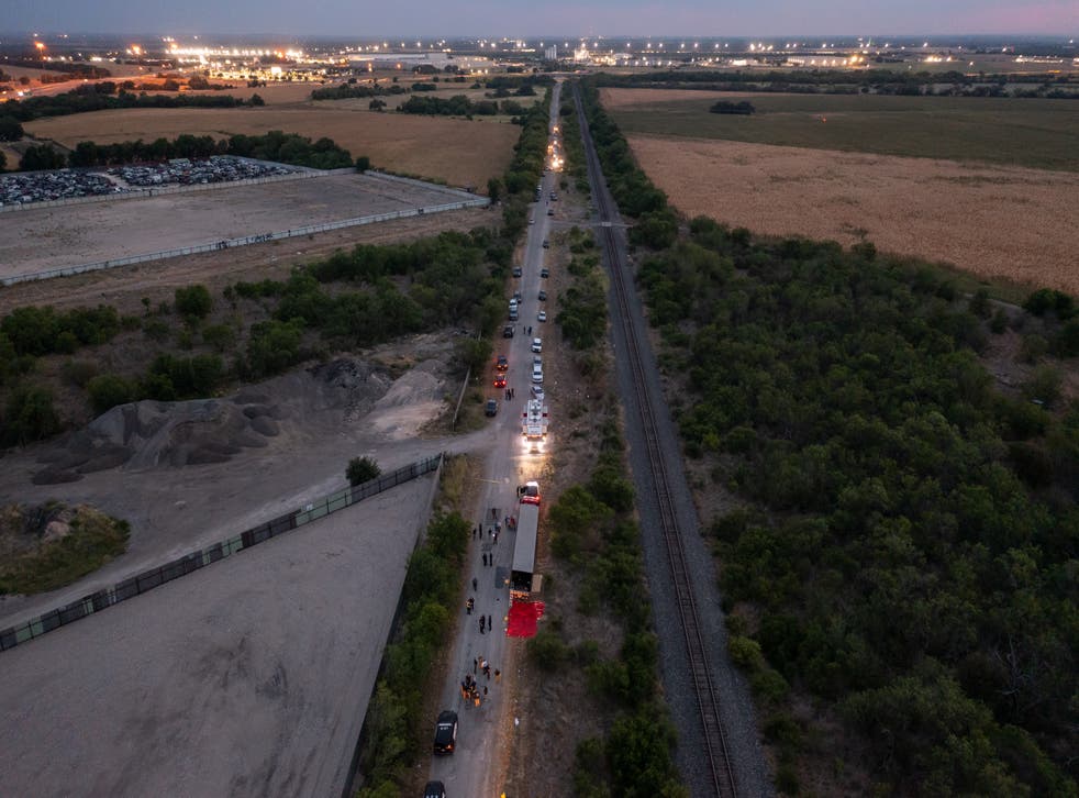 <p>In this aerial view, members of law enforcement investigate a tractor trailer on 27 June 2022 in San Antonio, Texas</p>