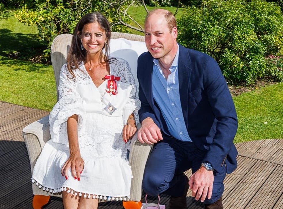 <p>James with Prince William after he presented her with a damehood</p>