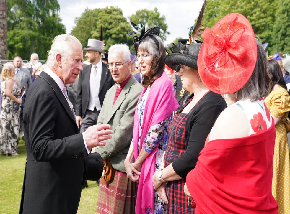 Charles talks to guests at the garden party (Jane Barlow/PA)