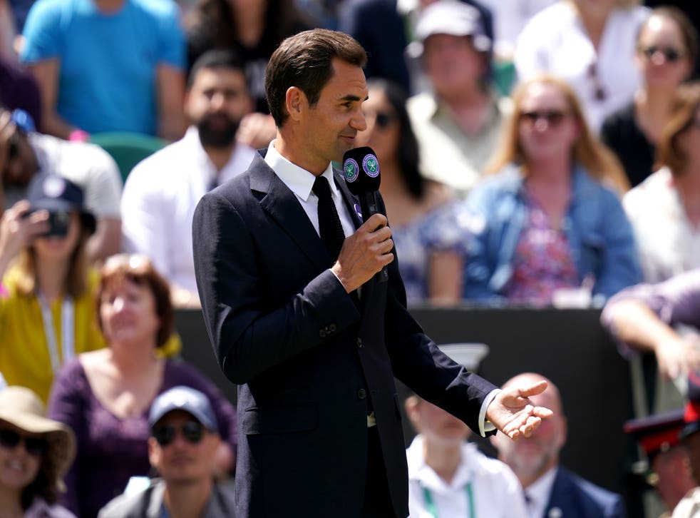 Roger Federer told spectators during a Centre Court centenary ceremony that he hopes to return to Wimbledon after recovering from his knee injury (John Walton/AP)