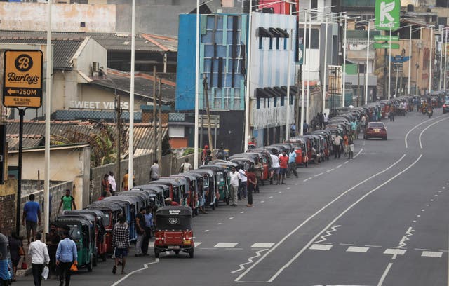 Three-wheelers queue to buy petrol due to fuel shortage, amid the country's economic crisis, in Colombo, Sri Lanka