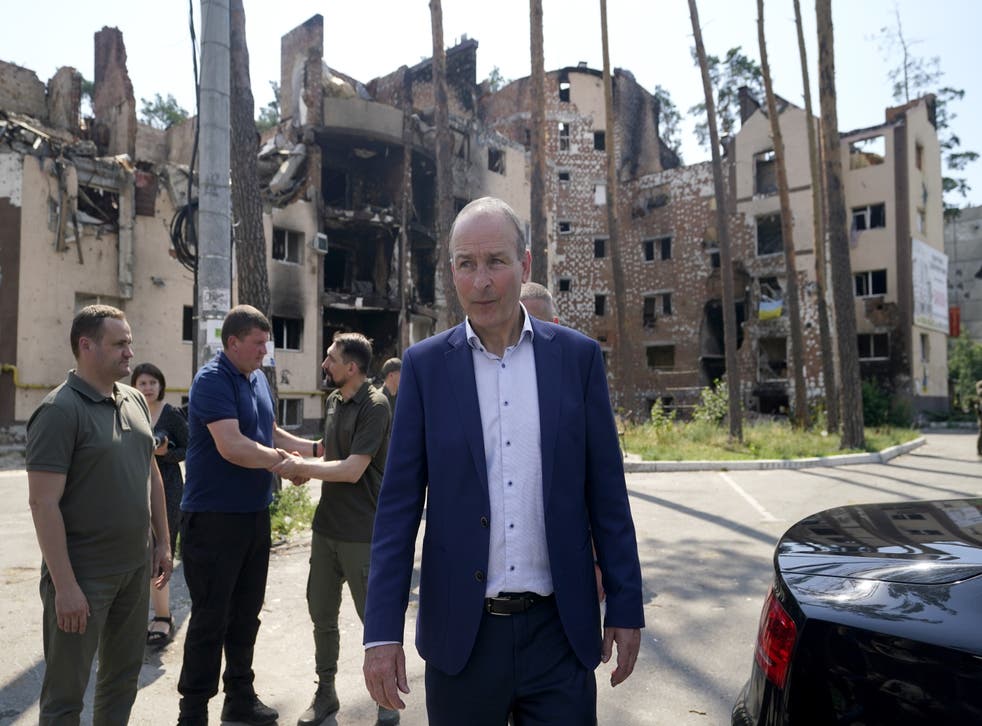 Micheal Martin viewing the damage to buildings in the city of Irpin (Niall Carson/PA)