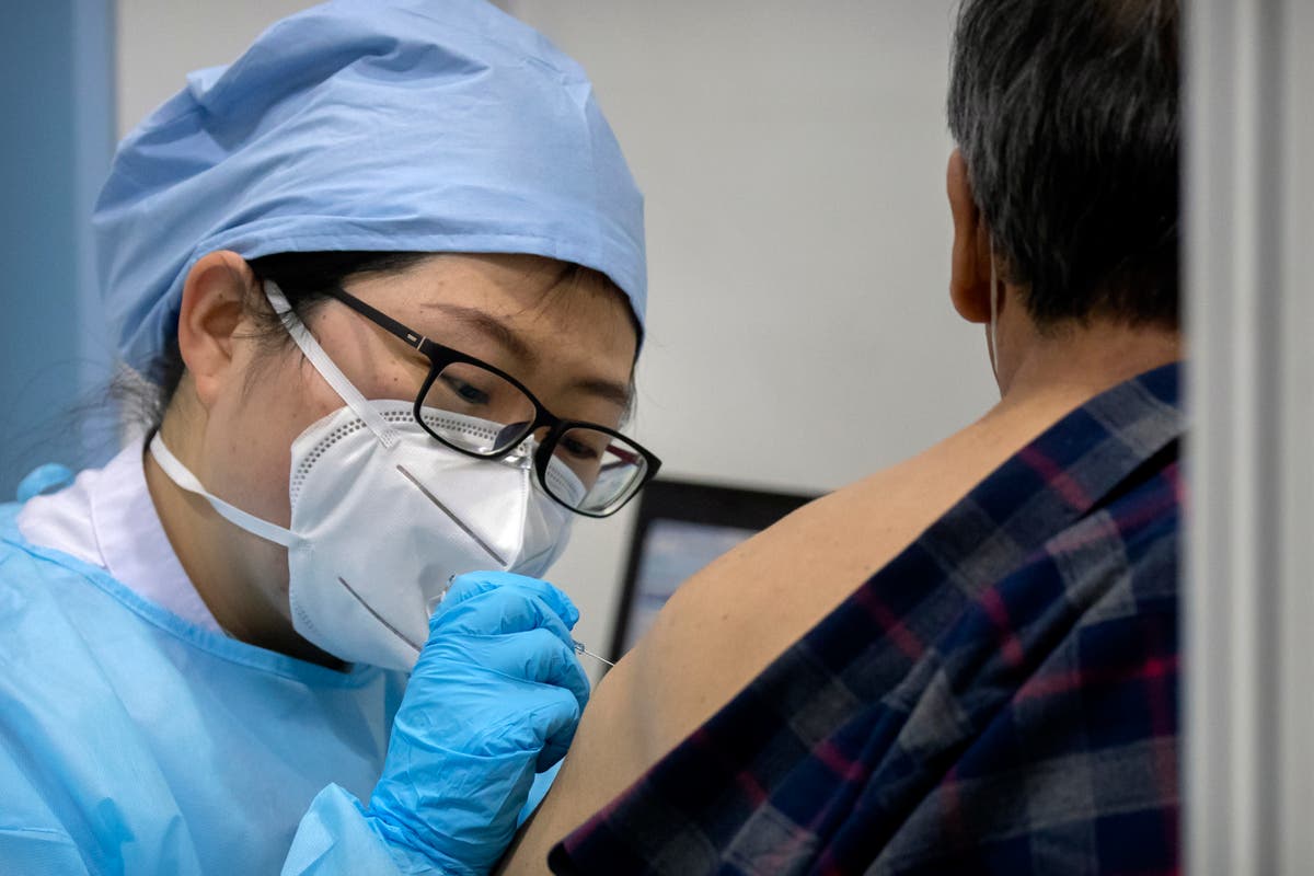 Beijing appears to retract vaccine mandate after pushback