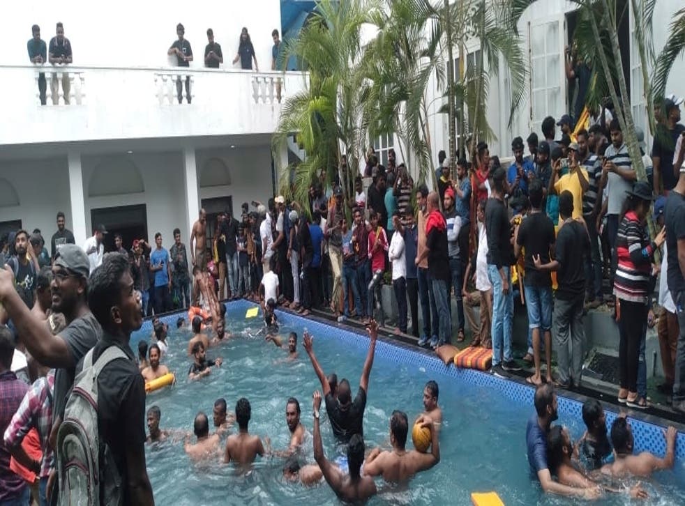 <p>Anti government protesters swim in a swimming pool of the Sri lankan president's official residence</p>