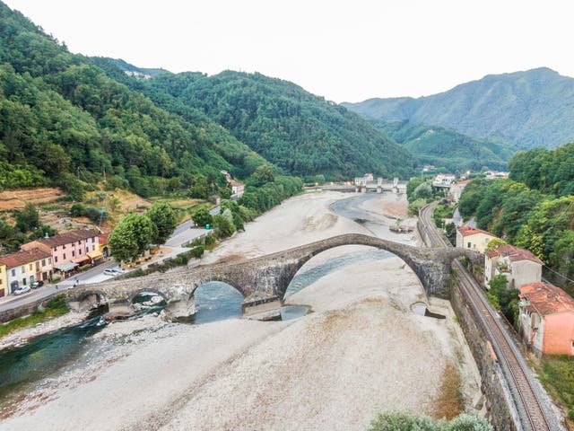 A view of the La Maddalena bridge over the dry Serchio river, near Lucca,  Tuscany region, central Italy