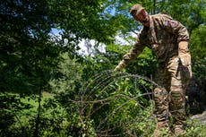 Slovenia army starts removing Croatia border razor wire