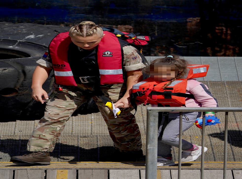 Several young children were among the large numbers of people brought ashore in Dover on Monday (Gareth Fuller/PA)