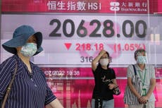 Asian shares slip as investors eye inflation, earnings