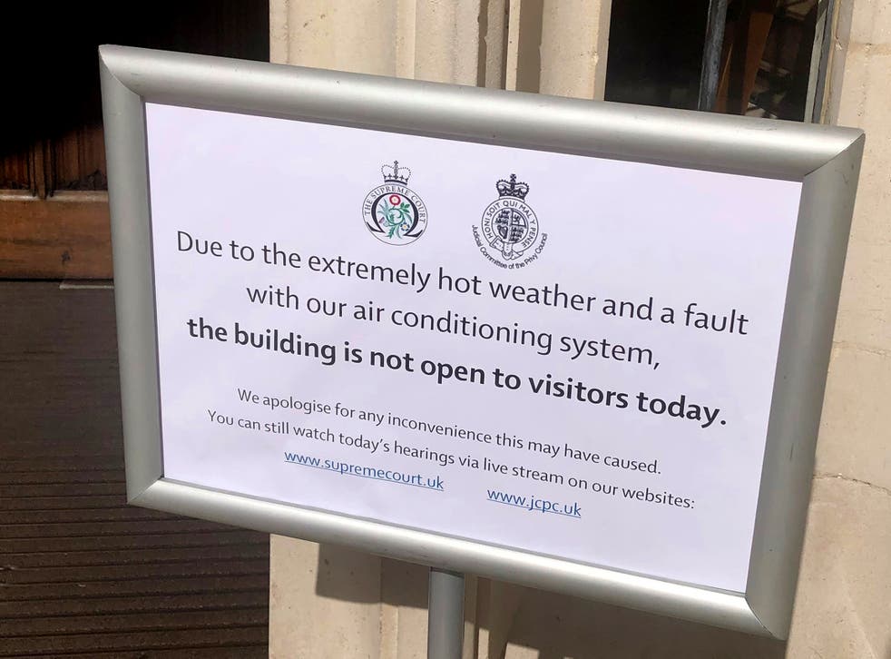 A sign outside The Supreme Court in London, explaining the building has been closed to visitors because of the temperatures and an air-conditioning fault (Brian Farmer/PA)