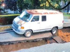 Video shows van being swallowed by a sinkhole after severe storms in NYC