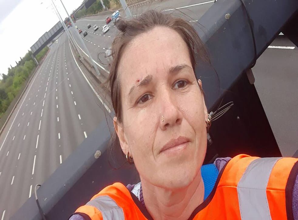One of the activists who climbed motorway signs on the M25 (Just Stop Oil/PA)