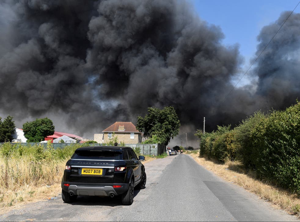 <p>Dramatic aerial footage from the area captured thick plumes of black smoke billowing from a row of collapsing houses</p>