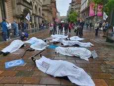 Climate activists stage ‘die-in’ protest in Glasgow following record temperatures