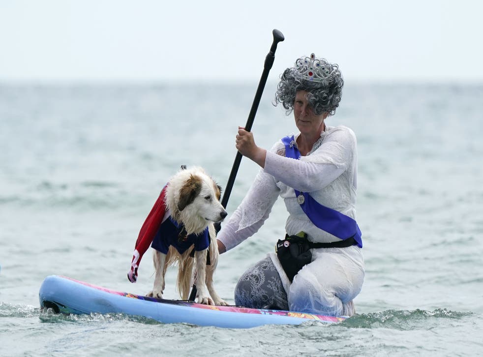 Elizabeth Wilkinson in costume with her dog Diogie (Andrew Matthews/PA)