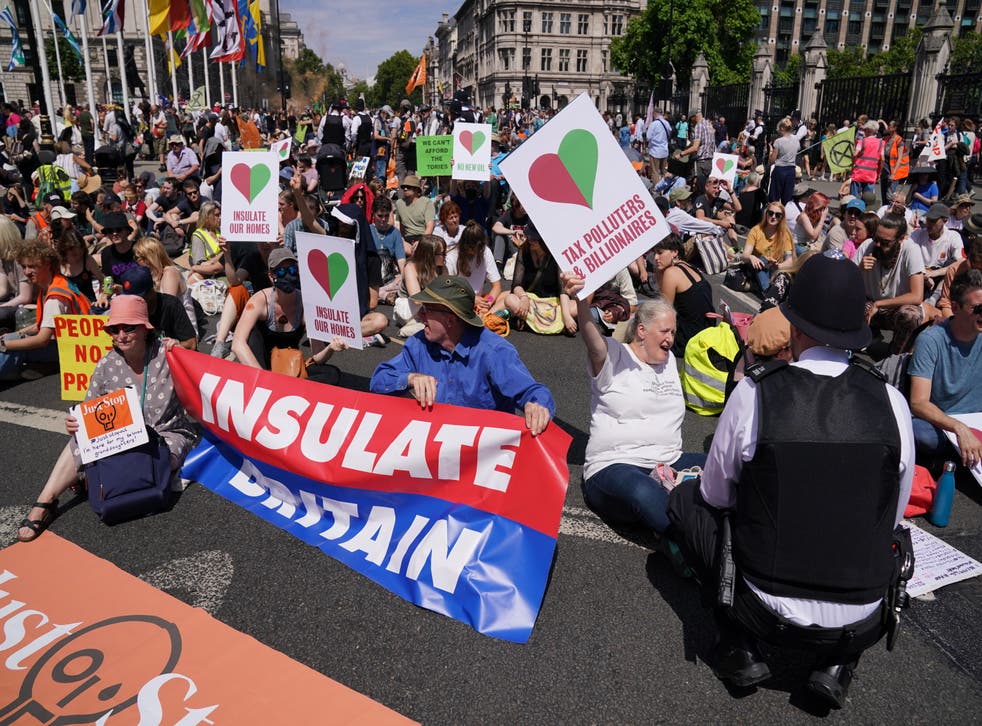 Police talking to members of environmental groups (Jonathan Brady/PA)