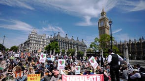 Members of environmental groups including Just Stop Oil, the Peace and Justice Project and Insulate Britain take part in a mass protest, in Parliament Square in London
