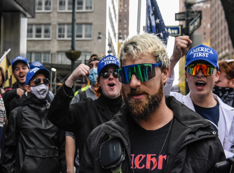 <p>Far-right live-streamer Baked Alaska is seen with white nationalists in New York City in November 2021. </s>