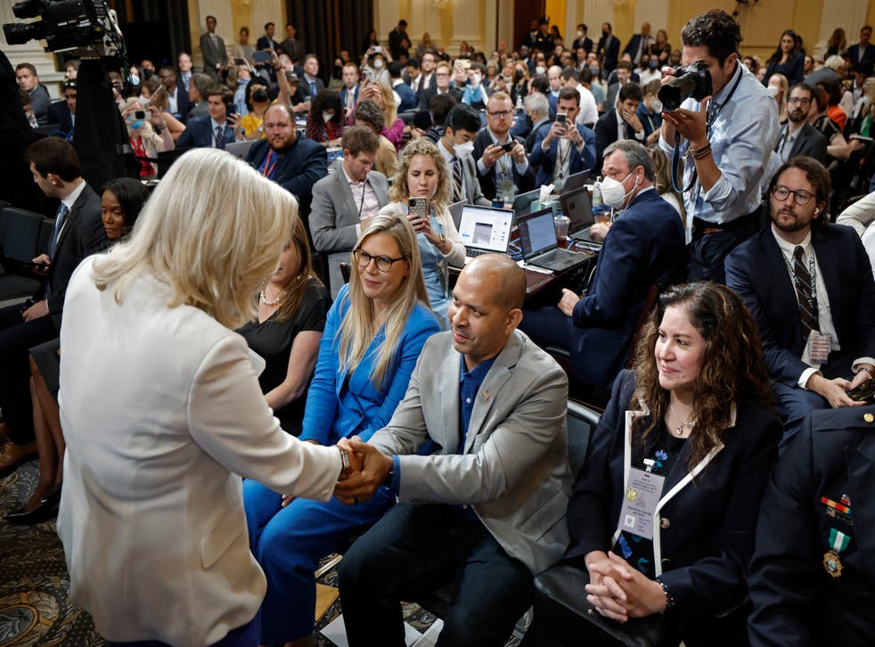 <p>Rep. Liz Cheney (R-WY), Vice Chairwoman of the House Select Committee to Investigate the January 6th Attack on the U.S. Capitol, shakes hands with former U.S. Capitol Police Officer Aquilino Gonell </s>