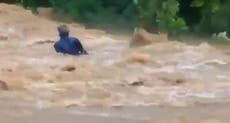 Video shows man being washed away while crossing flooded Indian road