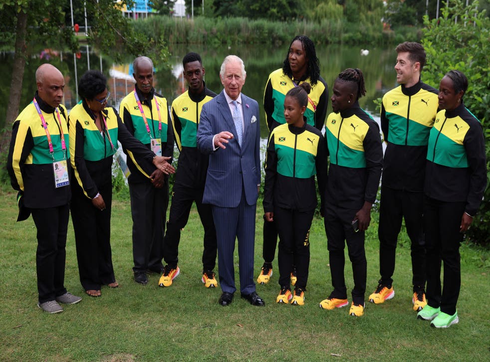 Charles with athletes and team members from Jamaica (Phil Noble/PA)