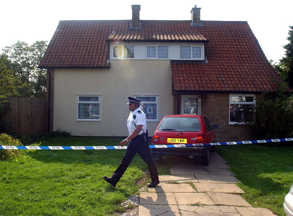 Police officers seal off the home of Ian Huntley and Maxine Carr (PA)