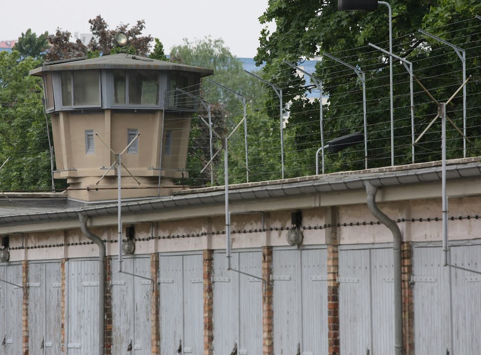 <p>A guard tower stands at a former prison of the East German Stasi</p>