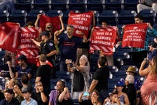 Activists rally outside congressional baseball game they vowed to ‘shut down’ amid Schumer-Manchin climate deal