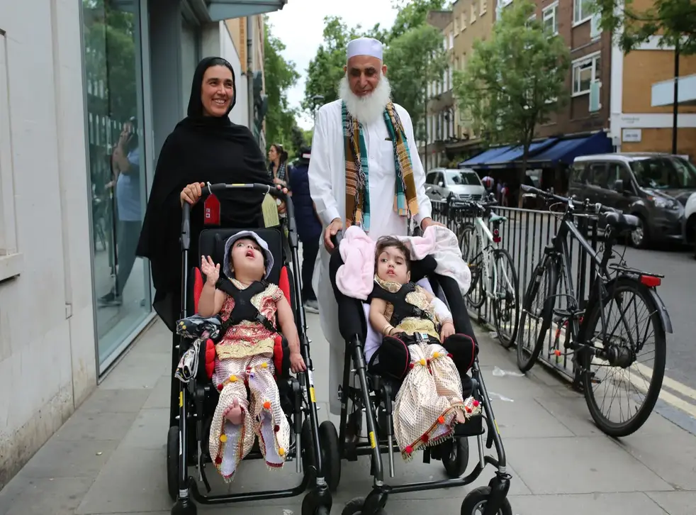 <p>Two-year-olds Safa and Marwa Ullah, from Charsadda, in Pakistan, leaving Great Ormond Street Hospital after a surgery to separate their heads with their mother Zainab Bibi and their grandfather Mohammad Sadat</s>