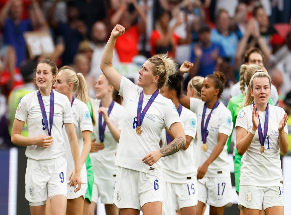<p>The Lionesses parade around Wembley with their winners’ medals </p>