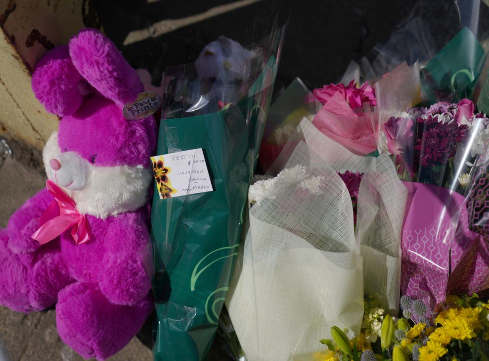 <p>Floral tributes left near to the scene</s>