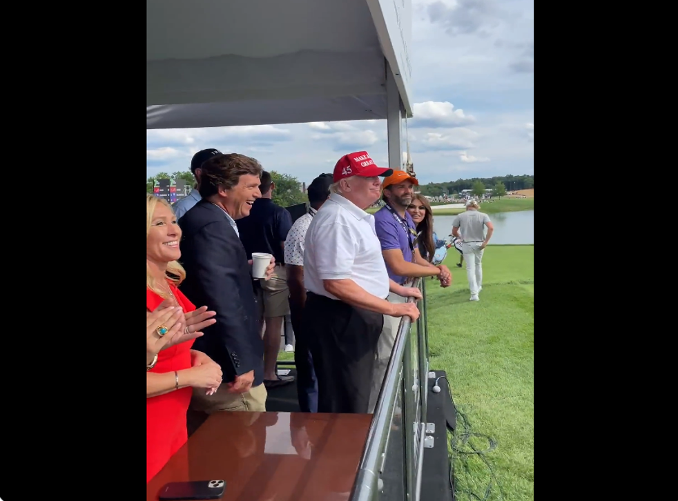 <p>Congresswoman Marjorie Taylor Greene, Donald Trump, Tucker Carlson and Donald Trump Jr stand in front of a crowd at the LIV Golf event at Trump’s Bedminster Golf Club in New Jersey over the weekend</p>