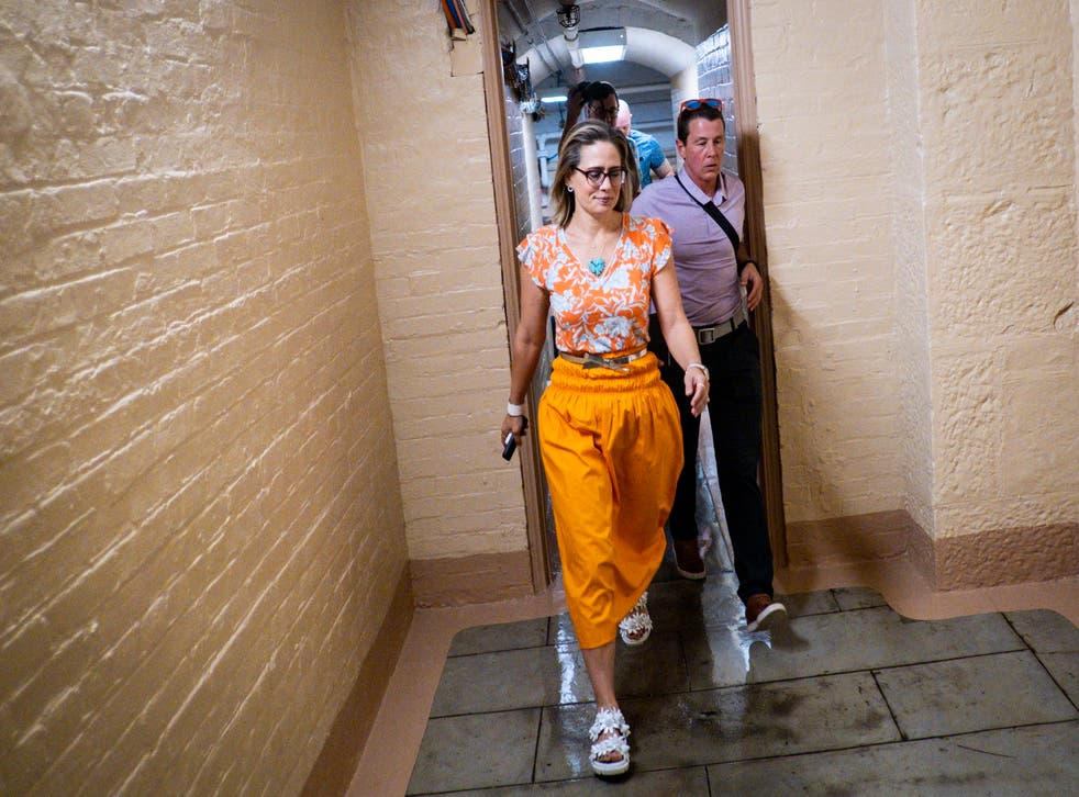 <p>Democratic Senator Kyrsten Sinema makes her way to the Senate floor on 4th August, 2022. She has agreed to add her critical support her party’s Inflation Reduction Act which will provide meaningful climate action</s>