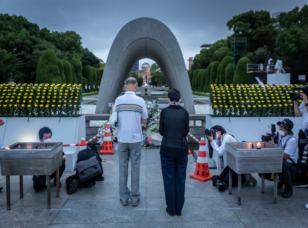 <p>People pray in remembrance of the Hiroshima atomic bombing. 6 August 2022 marks the 77th anniversary of the atomic bombing of Hiroshima during the Second World War in which between 90,000-146,000 people were killed and the entire city destroyed in the first use of a nuclear weapon in armed conflict</p>