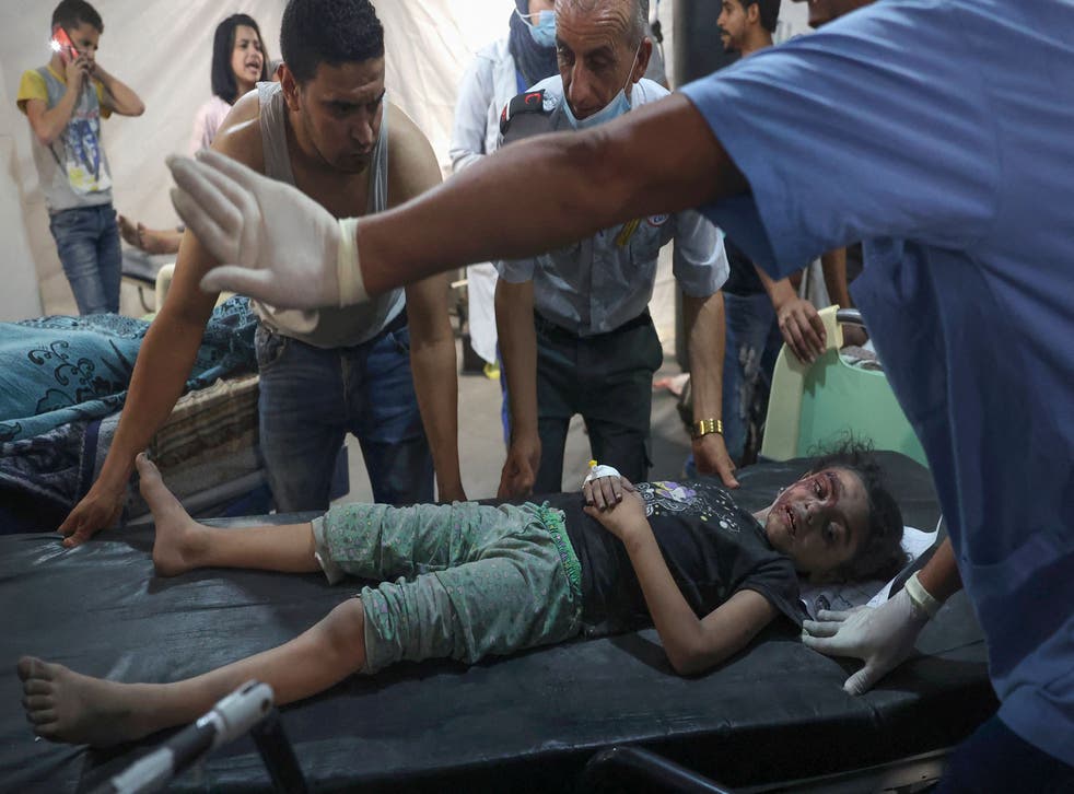 <p>Palestinian medics transport an injured girl to the hospital following a reported Israeli strike in Rafah in the southern Gaza Strip,</p>