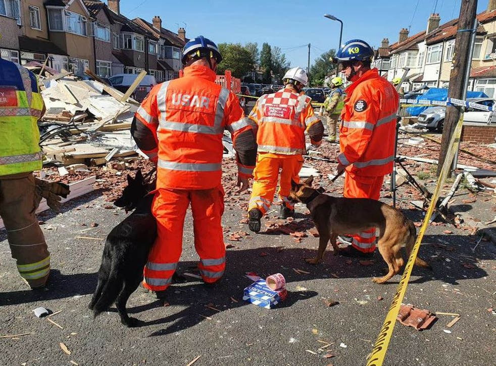 <p>Members of the Urban Search and Rescue team at the scene in Galpin’s Road in Thornton Heath, sør London (London Fire Brigade/PA)</psgt;